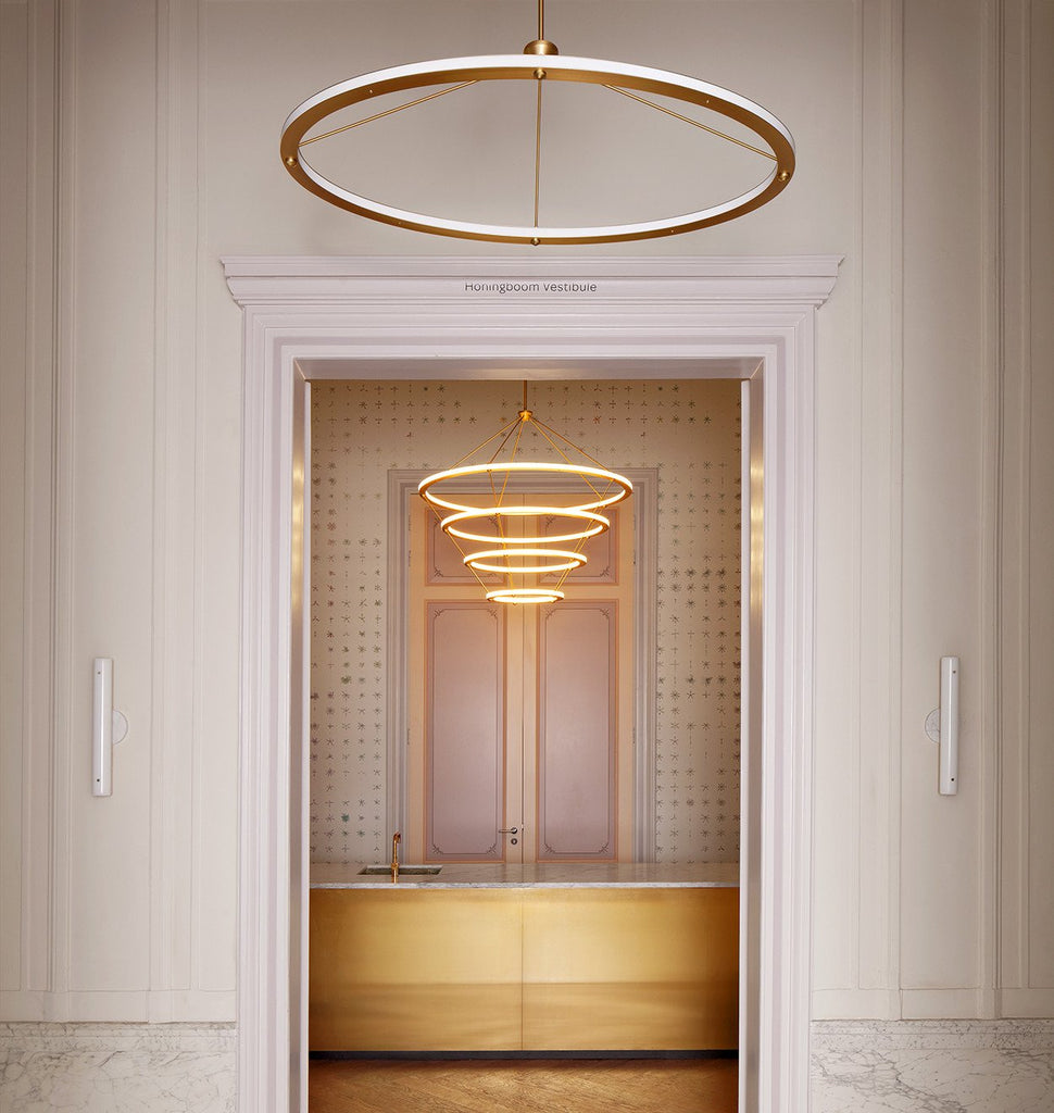 Oval Pendant (Brushed brass) and Chandelier - 4 Rings (Brushed brass) — Natura Artis Magistra, Amsterdam. Courtesy of BigBrands and Studio Linse